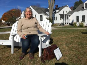 Allison Turner sitting on chair in a backyard