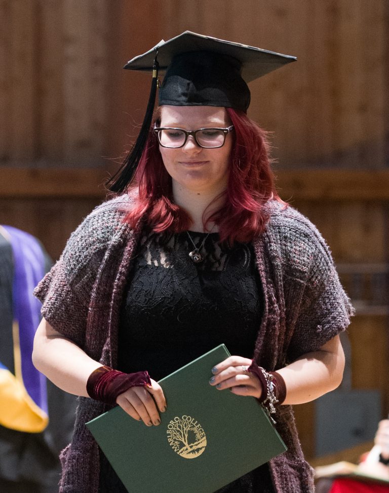 Student holding their diploma