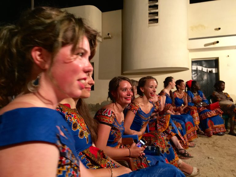 Students smiling while wearing dance clothing