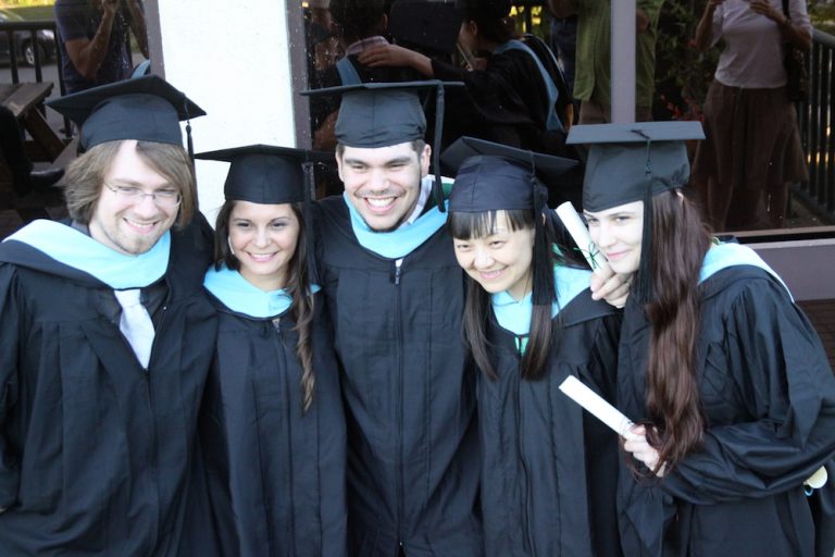 Row of graduating students posing for picture