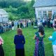 People gathered on a lawn for an event