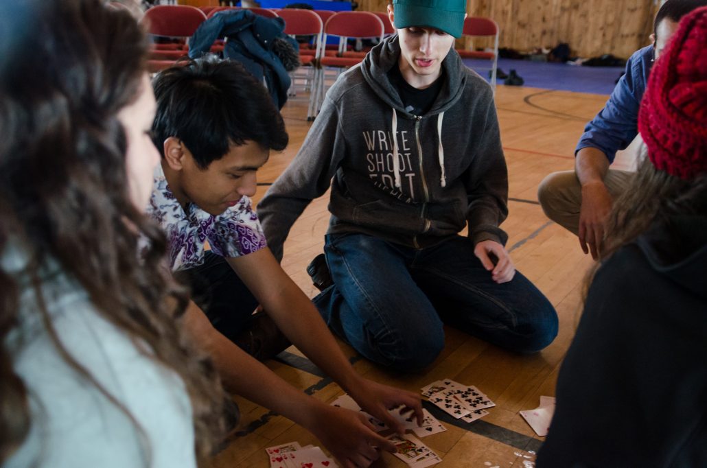 Faza “Jimmy” Hikmatullah playing cards with friends