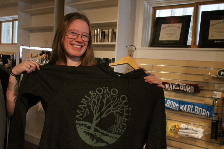 Sophie Gorjance holding up a Marlboro sweatshirt