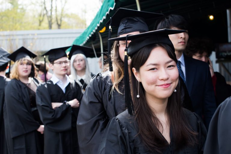 Students lining up in Commencement regalia