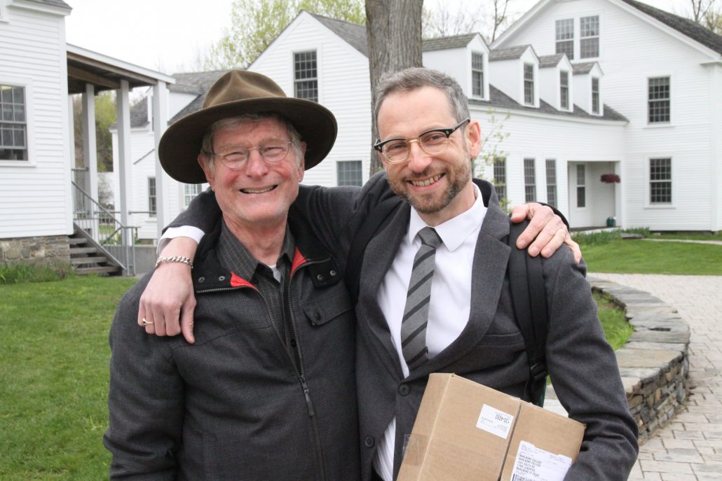 Sean Cole & Faculty member arm in arm