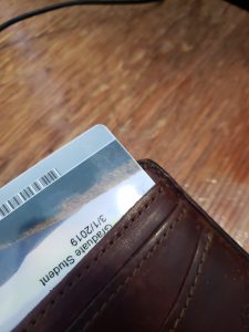 Student ID slightly poking out from a wallet pocket