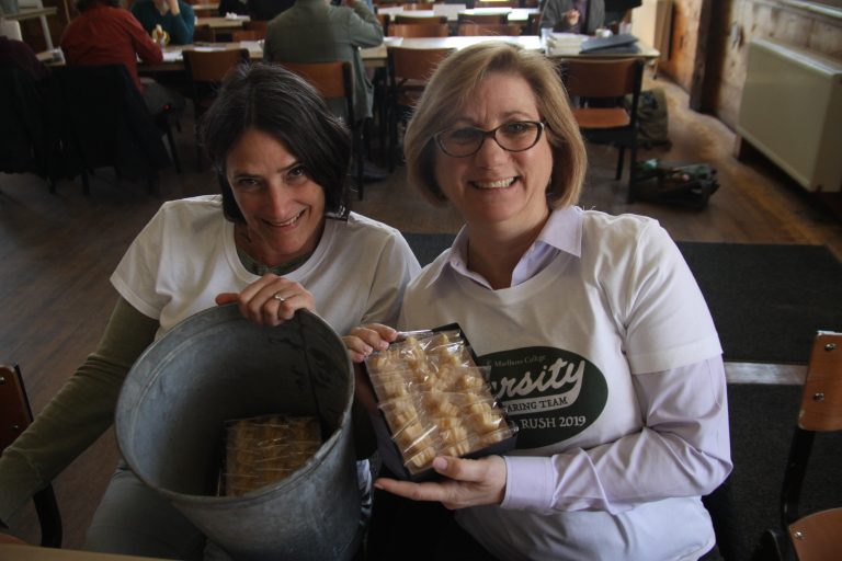 two people holding up products