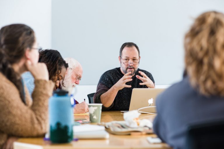 person speaking to a group of students