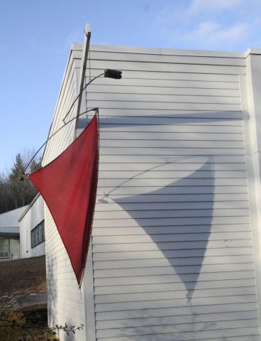 side of a building with red flag